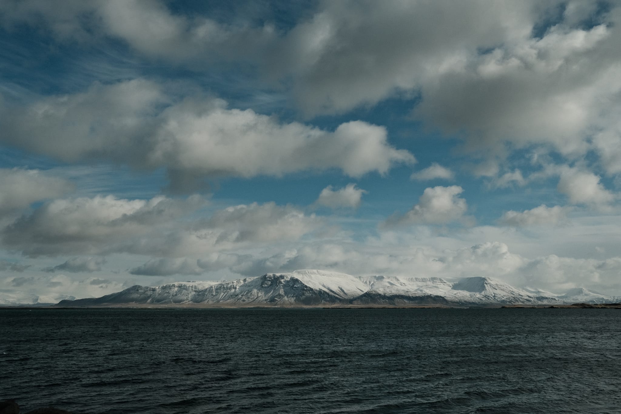 Mount Esja — Snow crowns the mountain across the bay.