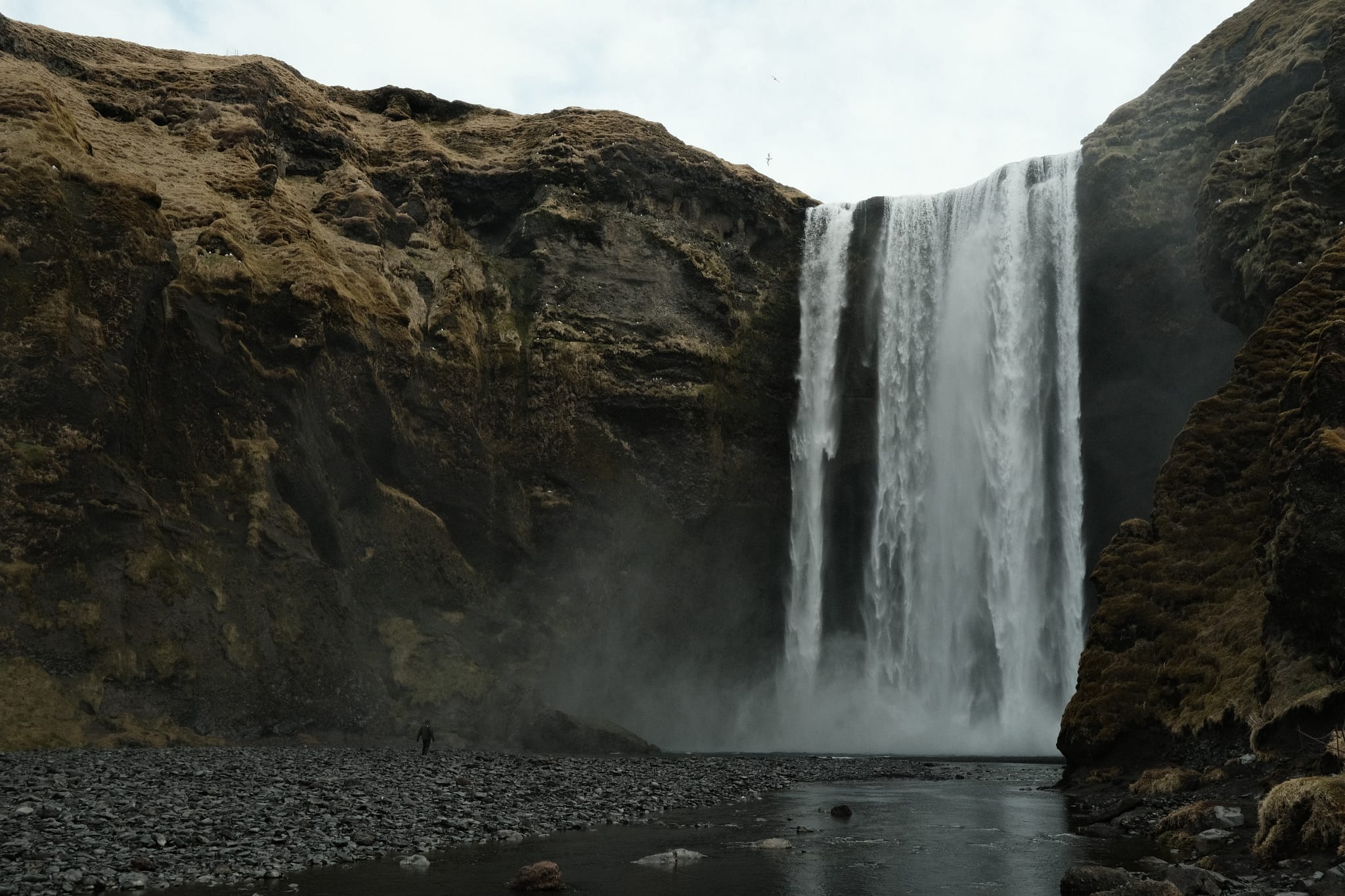 Skogafoss — The great curtain of water thunders down.