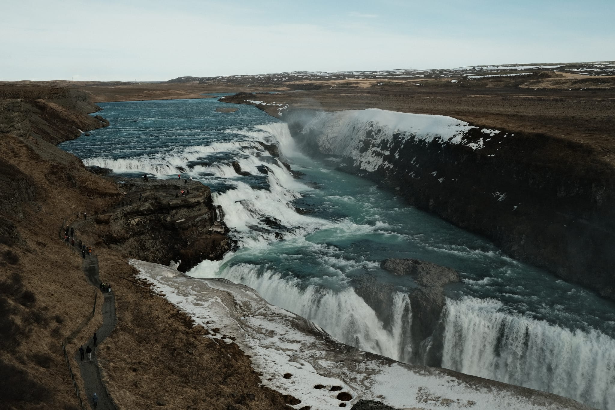 Gullfoss — The river tumbles in tiers down a broad canyon.