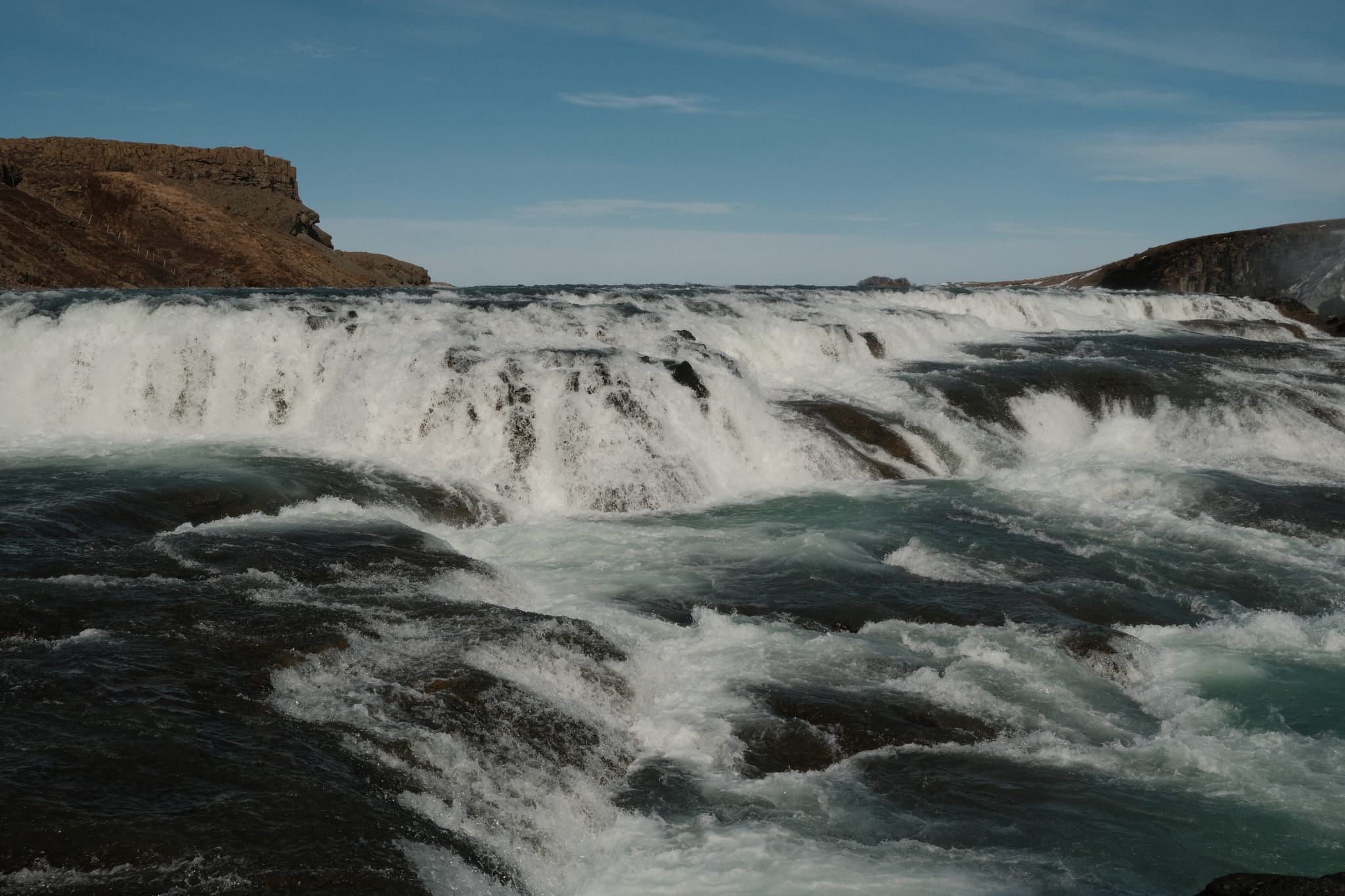 Glacial Rapids — White water surges across the river's step.